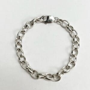 Silver chain bracelet on white background.