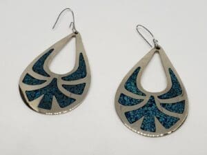 Silver teardrop earrings with blue inlay.
