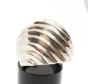 Silver ring with a ribbed design.