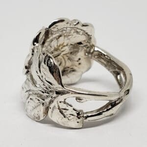 Silver ring with floral design.