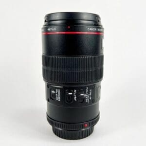 Canon camera lens with red ring detail.