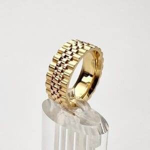 Gold and rose-gold textured ring display.