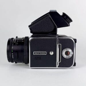 Vintage black medium format camera, side view.