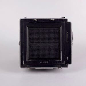 Square black vintage camera lens front view.