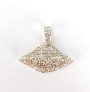 Diamond-encrusted UFO-shaped pendant.