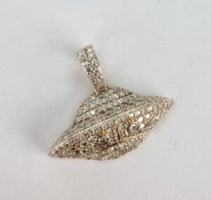 Diamond-studded UFO-shaped pendant on display.