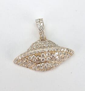 Diamond-studded UFO-shaped pendant on display.