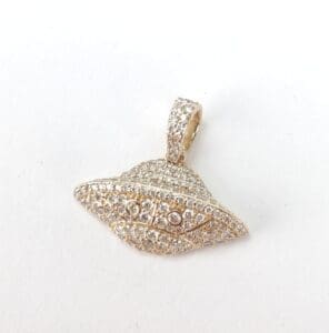 Gold UFO-shaped pendant with sparkling stones.