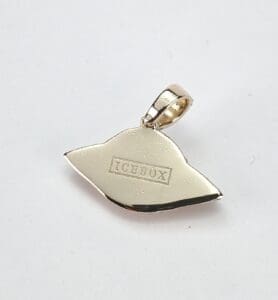 Gold pendant with "ICEBOX" inscription, plain background.