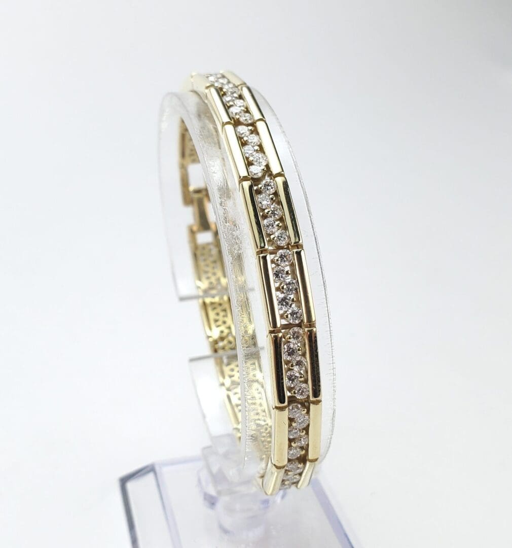 Gold bracelet with embedded sparkling diamonds.