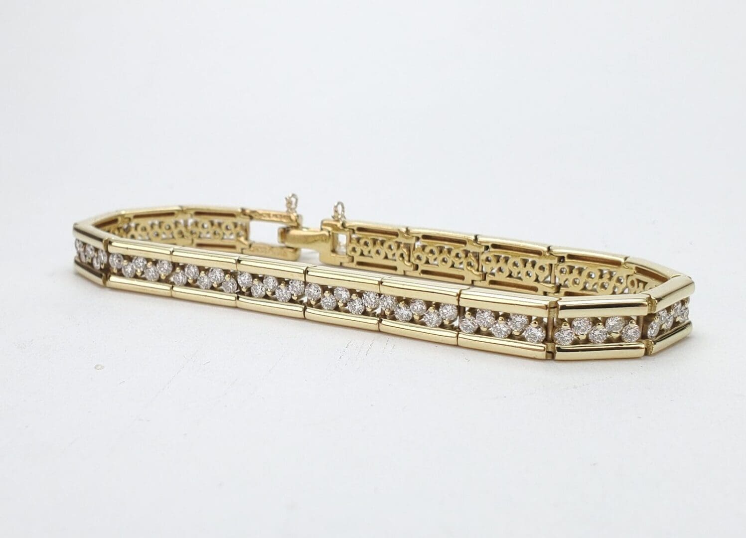 Gold bracelet with diamond accents.