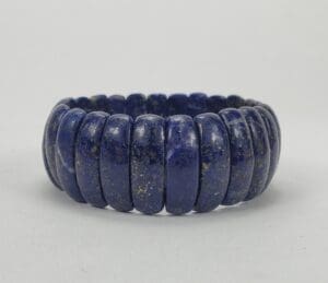 Blue stone bracelet with rounded segments.