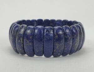 Blue stone beaded bracelet on display.