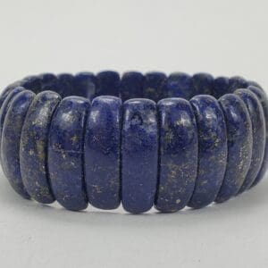 Blue stone beaded bracelet on display.
