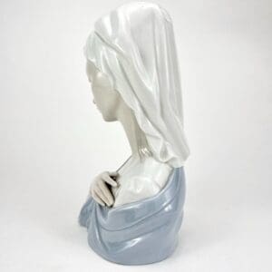 Porcelain bust of a veiled woman.