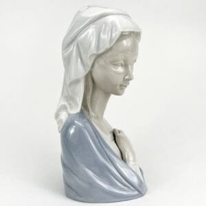 Porcelain bust of a woman with shawl.