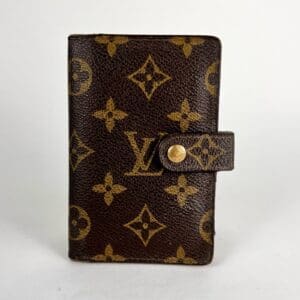 Luxury monogrammed wallet with button clasp.
