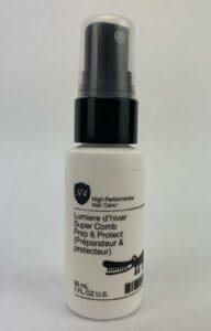 Hair care spray bottle with nozzle top.