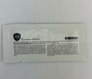 Hair mask sample packet with product description.