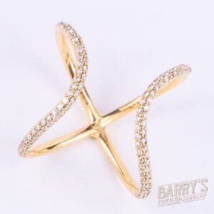 Gold criss-cross ring with diamonds.