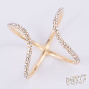 Gold criss-cross ring with diamonds.