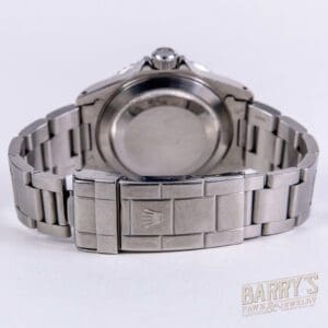 Silver wristwatch with metal bracelet clasp.