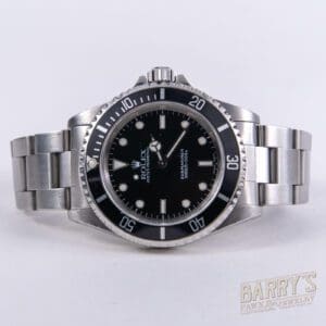 Silver Rolex watch with black dial.