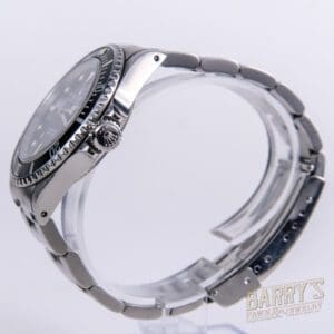 Silver wristwatch with metal bracelet, side view.