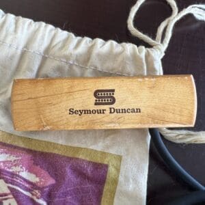 Seymour Duncan wooden guitar pickup on pouch.