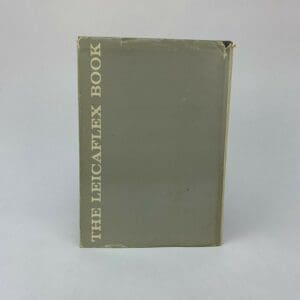 The Leicaflex Book with worn cover.