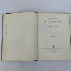 Open book titled "The Leicaflex Book".