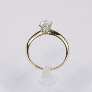 Gold ring with a single diamond.