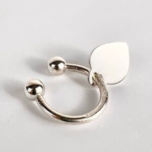 Silver ring with leaf-shaped design.