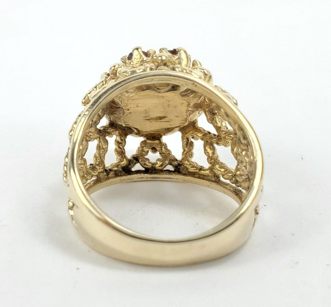 Ornate gold ring with intricate detailing.