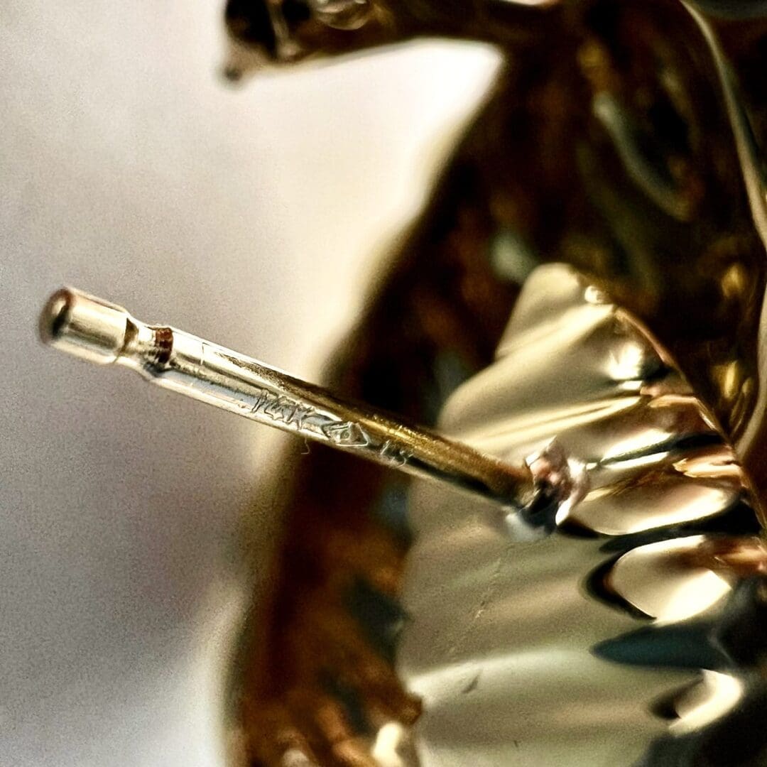 Close-up of a golden chess knight.