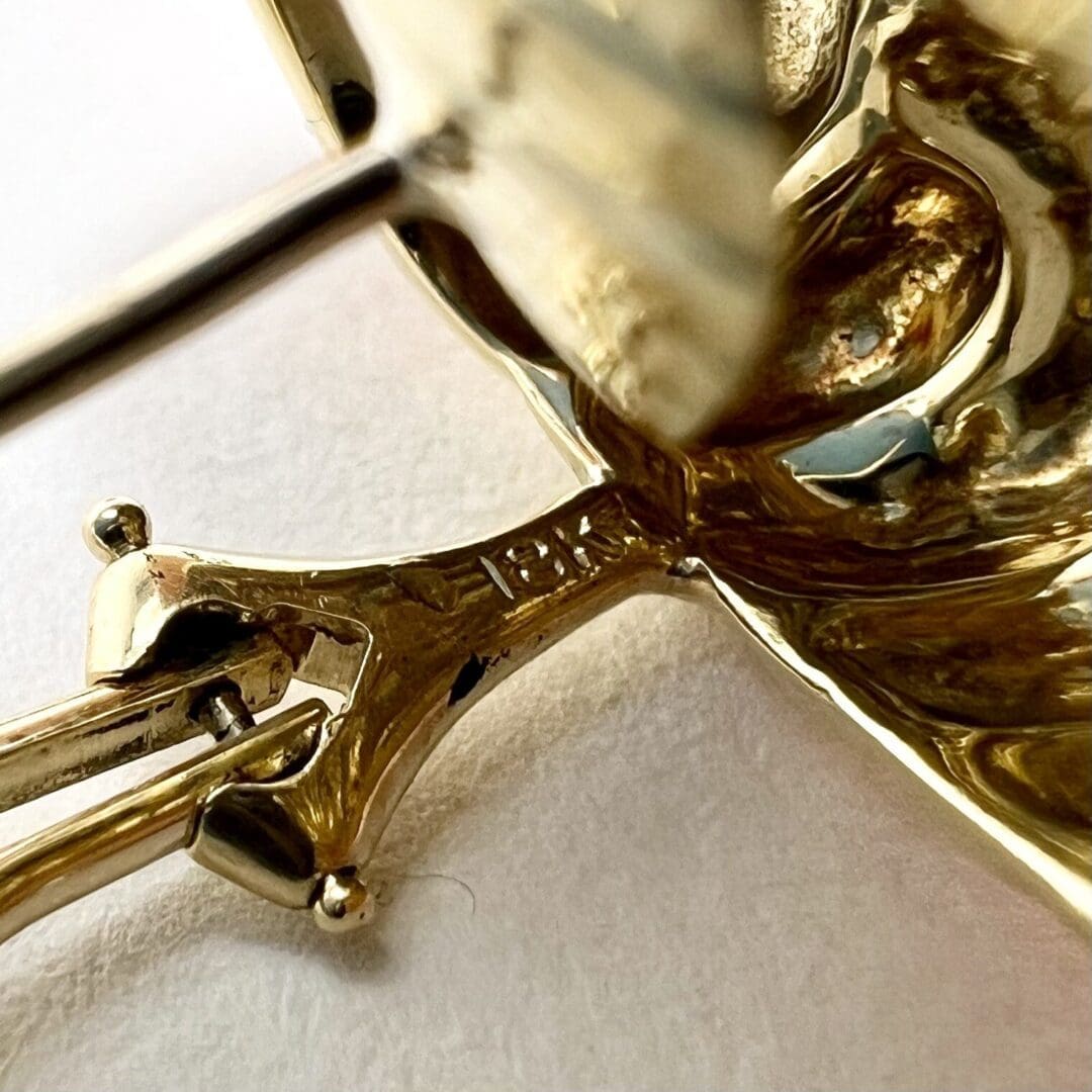 Close-up of a shiny gold metal object.