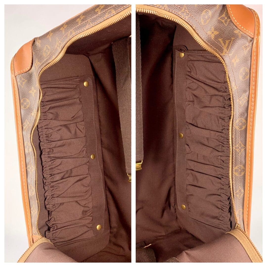 Open designer handbag with brown interior.