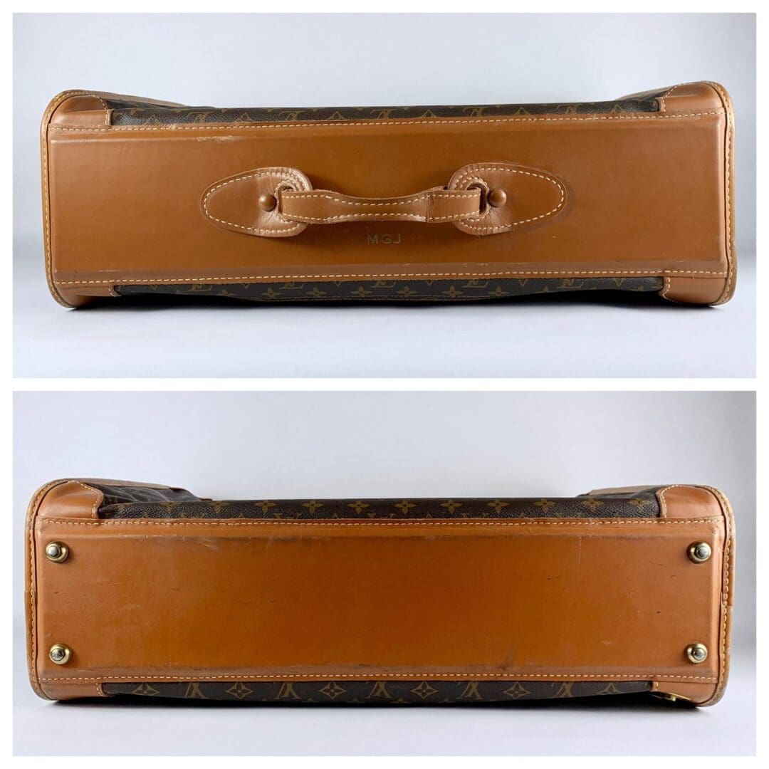 Brown leather suitcase with bottom view.