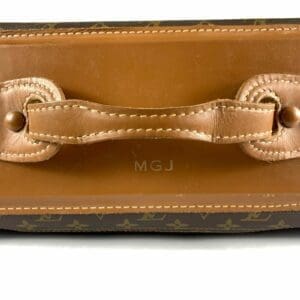 Brown leather bag with monogrammed initials.