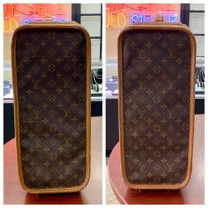 Luxury monogrammed handbag on display table.