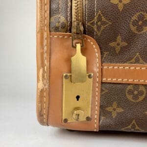 Close-up of luxury handbag leather and lock.