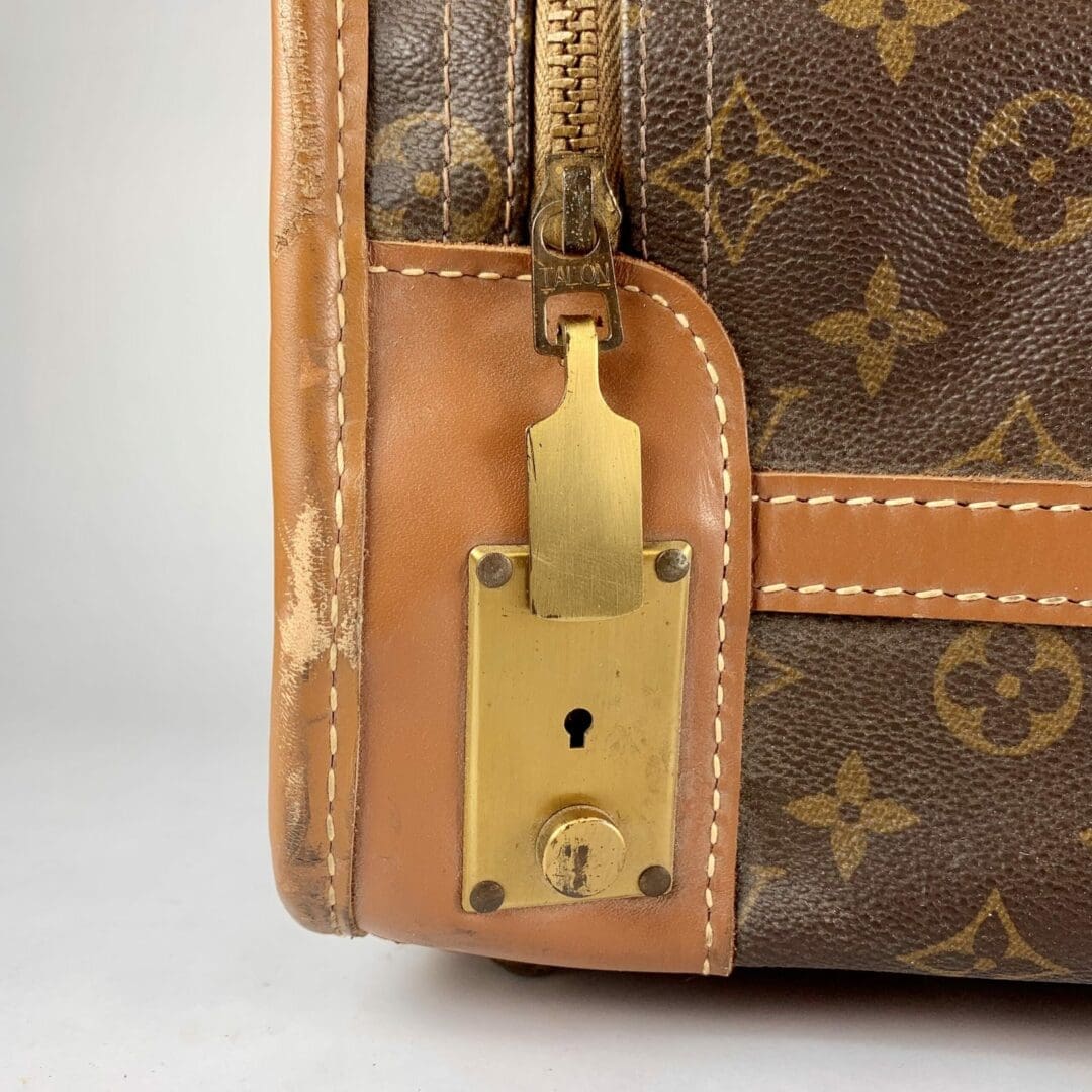 Close-up of luxury handbag leather and lock.
