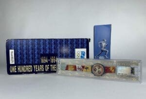 Swatch watch with Olympic-themed packaging.