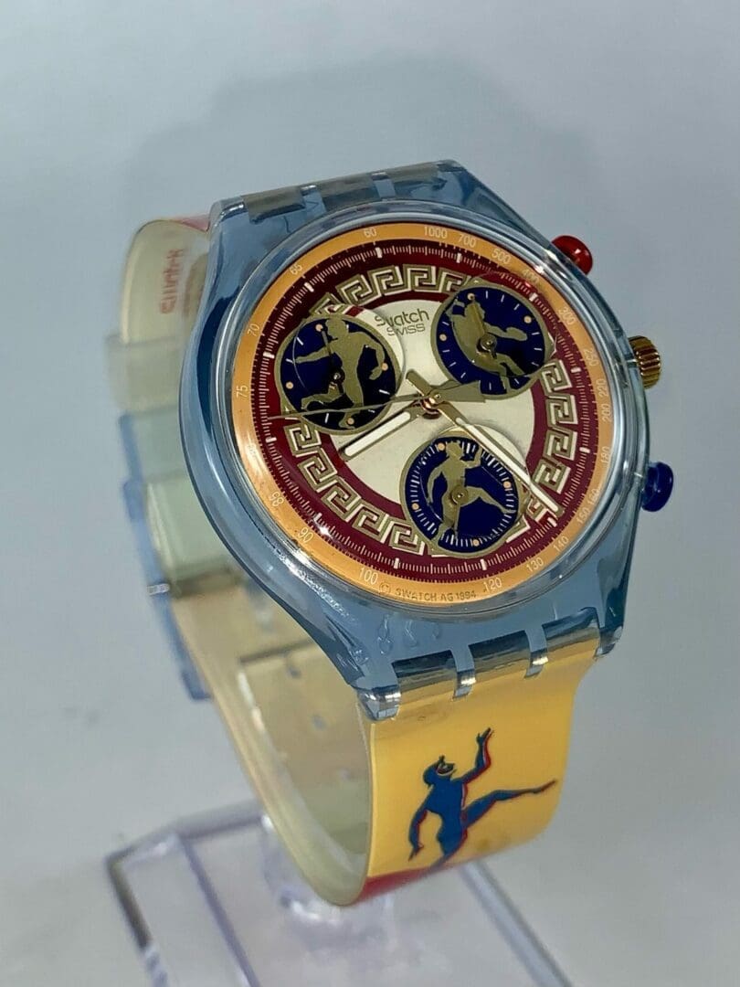 Colorful wristwatch with Greek-inspired design.