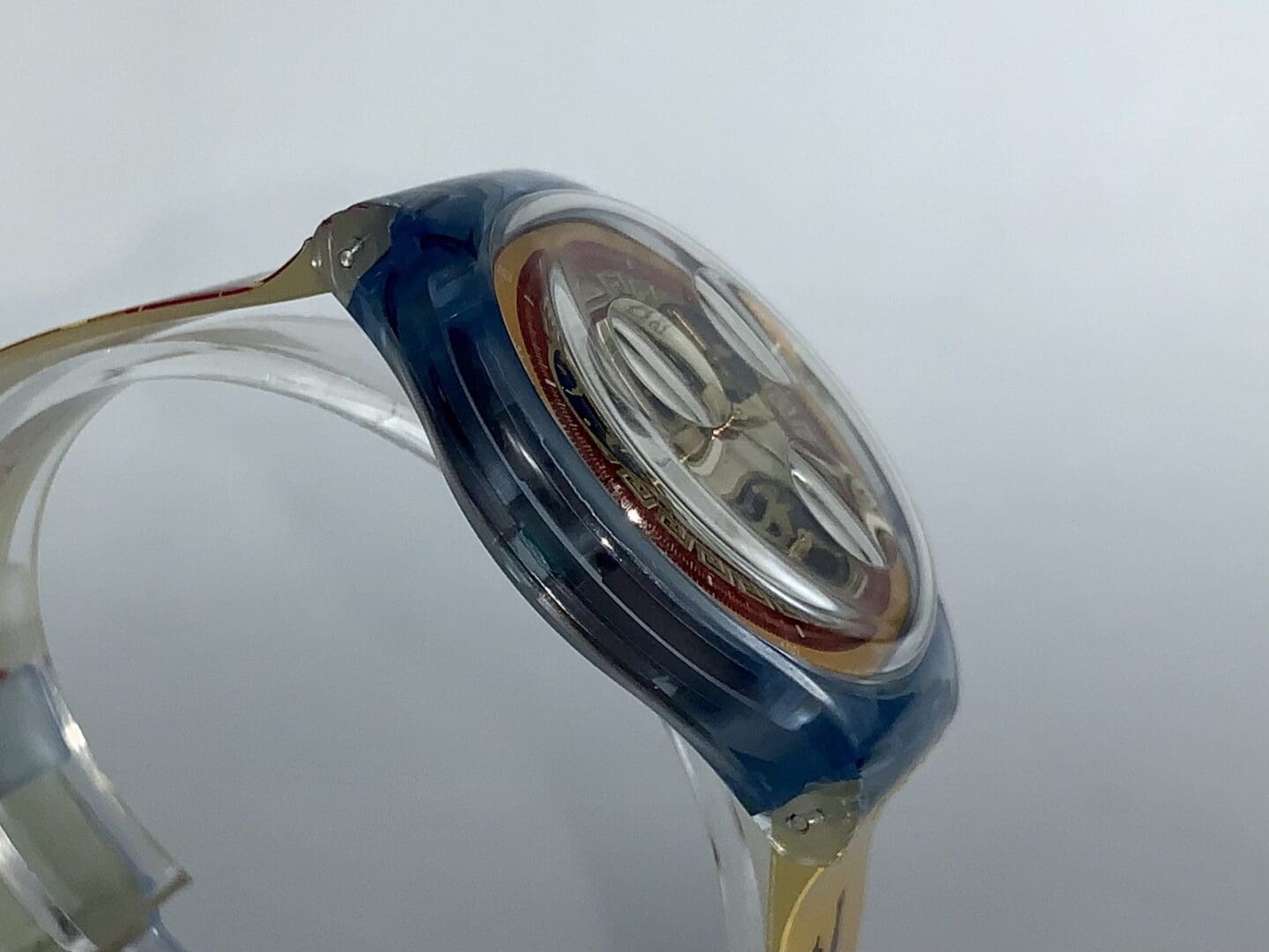 Side view of a transparent wristwatch.