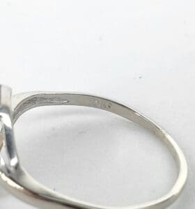 Silver ring with engraving on the band.