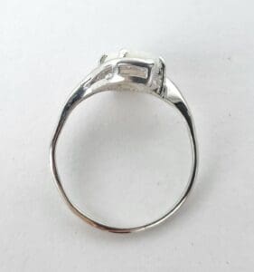 Silver ring with car-shaped design.