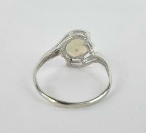 Silver ring with empty stone setting.