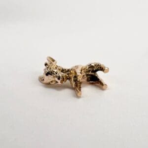 Golden cow figurine on white background.