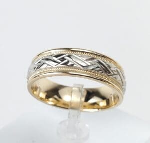 Two-tone braided design gold ring.